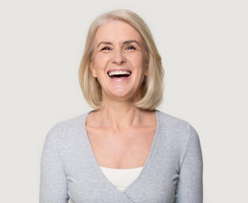 blond middle aged female smiling